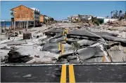  ?? JOE RAEDLE / GETTY IMAGES ?? State Road 98 is torn up at Mexico Beach in Florida’s Panhandle after Hurricane Michael slammed through the area, shattering scores of homes.