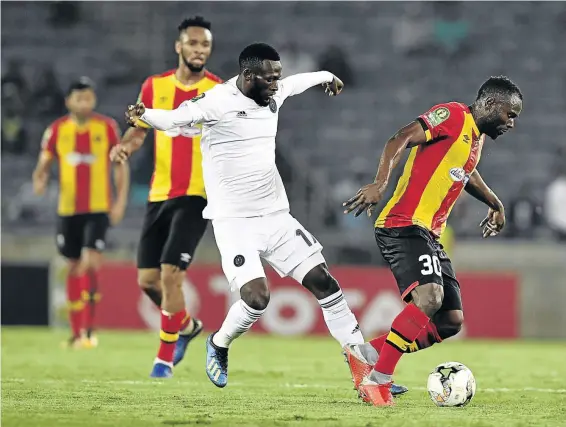  ?? /LEFTY SHIVAMBU/GALLO IMAGES ?? Orlando Pirates’ Augustine Mulenga challenges Franck Nom of Esperance during their first CAF Champions League match two weeks ago. The Tunisian giants won 2-0 behind closed doors at Stade Olympique de Rades in Tunis yesterday.