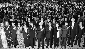  ?? — Bernama photo ?? Idris (seventh left) with his deputy, Datuk Dr Mary Yap Kain Ching (sixth left), Higher Education secretary-general Tan Sri Dr Noorul Ainur Mohd Nur and others shouting the ‘Soaring Upwards’ slogan at the event in Putrajaya yesterday.