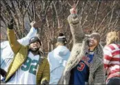  ?? GENE WALSH — DIGITAL FIRST MEDIA ?? Eagles players Fletcher Cox and Chris Long wave to fans during their Victory Parade on February 8.