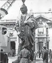  ?? AP FILE PHOTO ?? The Christophe­r Columbus statue is shown in Italy being readied for a trip aboard the Italian liner Cristoforo Colombo for shipment to the United States in 1955.