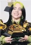  ?? AP ?? Billie Eilish poses with awards she won at this year’s Grammy Awards. Changes are being made to several categories, including the best new artist title.