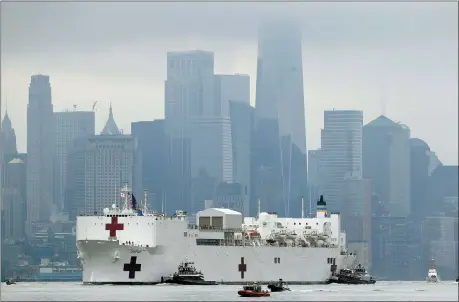  ?? SETH WENIG — THE ASSOCIATED PRESS ?? The Navy hospital ship USNS Comfort passes lower Manhattan on its way to docking March 30in New York. The ship has 1,000beds and 12 operating rooms that could be up and running within 24 hours of its arrival on Monday morning.