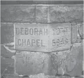  ?? COURANT FILE PHOTO ?? A cornerston­e identifies the 136-year-old Deborah Chapel at Beth Israel Cemetery in Hartford’s Frog Hollow neighborho­od.