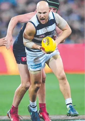  ?? Picture: QUINN ROONEY ?? FIRED UP: Gary Ablett leads the way in Geelong’s comeback.