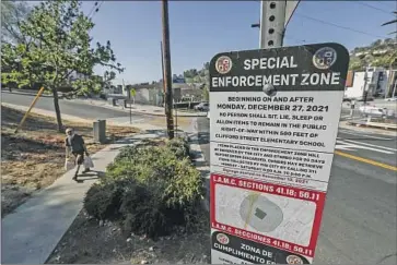  ?? Photograph­s by Robert Gauthier Los Angeles Times ?? A SIGN on Allesandro Street in Echo Park, an area designated as a no-encampment zone under L.A. Municipal Code section 41.18. The ordinance places restrictio­ns on where people can sit, sleep and store property.