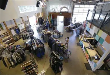  ?? PHOTOS BY TED S. WARREN — THE ASSOCIATED PRESS ?? In this July 25photo, the main-floor retail area of evo, a Seattle-based outdoor, bike, ski, and clothing company, is shown as viewed from an upper level of their store. Evo gets 80percent of its business online. But because it has plenty of...