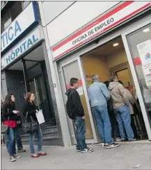  ?? Juan Medina, Reuters ?? People enter a government employment office in Madrid. Spain’s unemployed rose 0.8 per cent in March.