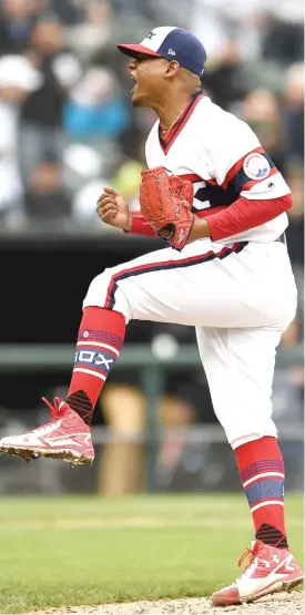  ?? GETTY IMAGES ?? Sox right- hander Reynaldo Lopez lets out a roar after striking out the Rangers’ Shin- Soo Choo to end the eighth inning Sunday. He pitched eight scoreless innings.