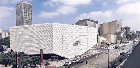  ?? Kirk McKoy
Los Angeles Times ?? DRAMATIC lifting of the museum’s front corners, coupled with the part of the veil that comes straight down, makes an eye-catching mix.