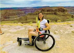  ?? GRIT; MARILYN ?? Marilyn pauses at an overlook to the Grand Canyon. Her off-road GRIT Freedom Chair, which can be self-propelled with levers, was invented by MIT researcher­s.