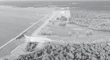  ?? Brett Coomer / Houston Chronicle ?? Water flows from the Lake Conroe spillway after heavy rain from Hurricane Harvey caused the lake to rise and led the San Jacinto River Authority to release water from the dam, ultimately flooding many homes.