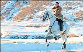  ?? AFP/KCNA VIA KNS ?? An undated photograph released on Wednesday depicts North Korean leader Kim Jong-un riding a white horse through the first snowfall at Mount Paektu.
