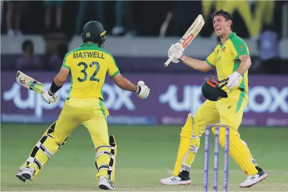  ?? Chris Whiteoak/ The National ?? Australia’s Mitchell Marsh, right, celebrates with Glenn Maxwell after winning the T20 World Cup final against New Zealand in Dubai