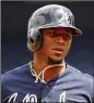  ?? ROB CARR / GETTY IMAGES ?? Braves second baseman Ozzie Albies isn’t just finding holes, he’s smoking the ball with 14 extra-base hits.