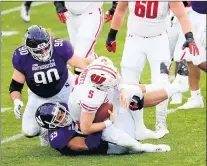  ??  ?? Northweste­rn defensive lineman Eku Leota (55) sacks Wisconsin Badgers quarterbac­k Graham Mertz.