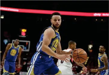  ?? AP PHOTO BY TED S. WARREN ?? Golden State Warriors guard Stephen Curry (30) dribbles during the first half of Game 4 of the NBA basketball playoffs Western Conference finals against the Portland Trail Blazers, Monday, May 20, in Portland, Ore.