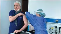  ?? PROVIDED TO CHINA DAILY ?? Giuseppe Bigatti, a doctor from Italy and director of the hysterosco­py center of Renji Hospital in Shanghai, receives the first dose of a COVID-19 vaccine in the city in January. He was vaccinated with the second dose in February.