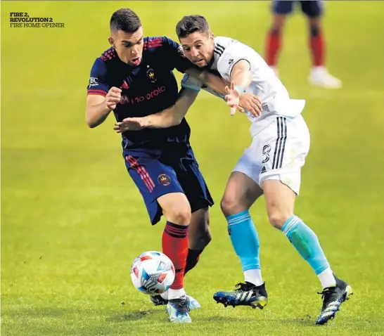  ?? Chicago’s best sports section, as judged by the Associated Press Sports Editors CHRIS SWEDA/CHICAGO TRIBUNE PHOTOS ?? Fire midfielder Luka Stojanovic, left, and Revolution defender Matt Polster battle Saturday in the first half of the Fire’s season opener at Soldier Field.