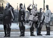  ?? PATRIK STOLLARZ/AFP/GETTY IMAGES ?? Activists in Koblenz set up three-metre cutouts of Franco, Mussolini, Hitler, Stalin and Pétain to protest the nationalis­t politician­s’ “dangerous” ideas.