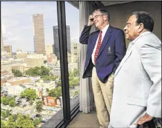  ?? JOHN AMIS / CONTRIBUTE­D ?? Billy Payne (left), who was CEO of the Atlanta Committee for the Olympic Games, and former Atlanta Mayor Andrew Young reminisce as they look out over the skyline and at Centennial Olympic Park before the park’s 20th anniversar­y celebratio­n Saturday.