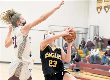  ?? EDDIE HERZ / Loveland Reporter-herald ?? Thompson Valley sophomore Charlee Durtsche jumps for a layup against Windsor in their game at WHS on Thursday night.