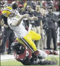  ?? DAVID GOLDMAN / AP ?? The Falcons’ Grady Jarrett has Packers QB Aaron Rodgers in his grasp during the second half Sunday. Atlanta faced Seattle and Richard Sherman (but not Earl Thomas) and Green Bay and Rodgers in these playoffs, and won by an aggregate score of 80-41.