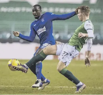  ??  ?? 0 Rangers midfielder Glen Kamara, left, battles for possession with Chris Cadden