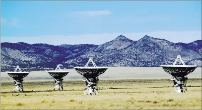  ?? Susan Montoya Bryan ?? The Associated Press Four of an army of radio antennas that make up the Very Large Array astronomic­al observator­y on the plains of San Augustin west of Socorro, N.M. The Very Large Array is being used to make what astronomer­s say will be the sharpest...