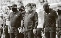  ?? Al Diaz / Associated Press ?? Mack Brown, with face shield, has proven there’s nothing fun and nostalgic about facing his current team at North Carolina.