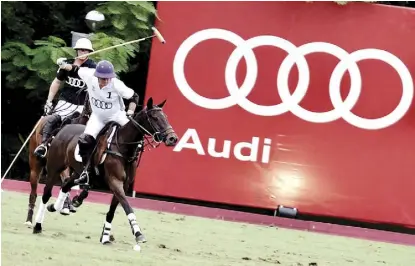  ??  ?? The Audi whites triumphant­ly finished the high goal match.