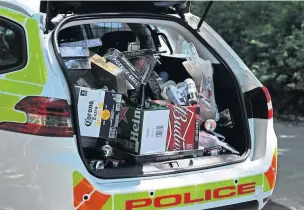  ??  ?? A police car boot in Freshfield filled with drink and barbecues