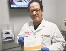  ?? Brian A. Pounds / Hearst Connecticu­t Media ?? Dr. Steven Heffer with the flu vaccine at AFC Urgent Care in Fairfield on Feb. 6.