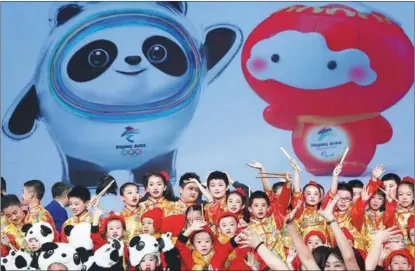  ?? ZOU HONG / CHINA DAILY ?? Bing Dwen Dwen (at left on screen) is introduced on Sept 17 in Beijing as the official mascot for the 2022 Beijing Olympic Winter Games, while Shuey Rhon Rhon (right) will be the mascot for the Paralympic Winter Games.