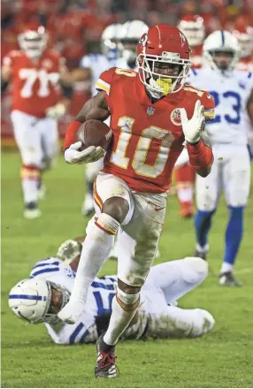  ??  ?? Chiefs wide receiver Tyreek Hill loses his shoe while running after a catch against the Colts on Saturday.