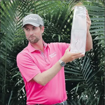  ?? LYNNE SLADKY/AP ?? Webb Simpson celebrates with the winner’s trophy after the final round of the Players Championsh­ip at TPC Sawgrass in Ponte Vedra Beach, Fla., yesterday.