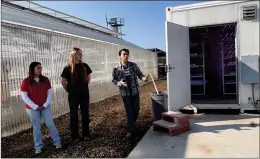  ?? ?? SHS seniors, left to right, Victoria Munoz, Macy Behrens and Job Bejarano talk about the school’s CROPBOX as they lead a tour on Wednesday during the grand opening of the Strathmore Technical Agricultur­e Research center.