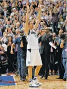  ?? TONY GUTIERREZ/THE ASSOCIATED PRESS ?? The Dallas Mavericks’ Dirk Nowitzki acknowledg­es cheers from fans during a timeout after Nowitzki scored his 30,000th career point during Tuesday’s game against the Los Angeles Lakers in Dallas.