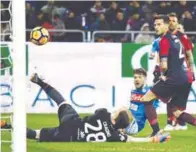  ??  ?? Napoli’s striker Dries Mertens (C) scores a goal during their Italian Serie A match against Cagliari at Sardinia stadium in Cagliari yesterday. –