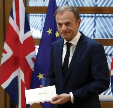  ??  ?? EU Council President Donald Tusk holding the letter from British Prime Minister Theresa May, triggering Article 50 for Uk’s withdrawal from the EU