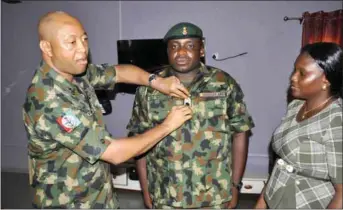  ??  ?? Brig. Gen. Aligbe decorating Major Danjuma