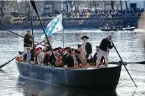  ?? Associated Press file photo ?? Historical reenactors demonstrat­e Gen. George Washington’s Christmas 1776 crossing of the Delaware River in 2016.