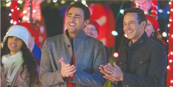  ?? HALLMARK ?? Jonathan Bennett, left, and Brad Harder star as a gay couple in The Christmas House — a movie in which their relationsh­ip is not central to the plot, but at least acknowledg­ed.