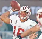  ?? RICK WOOD / MILWAUKEE JOURNAL SENTINEL ?? In his only season at UW, Russell Wilson completed 72.8% of his passes for a program-record 3,175 yards with 33 TDs and four intercepti­ons.