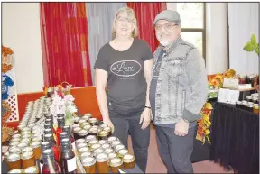  ?? (NWA Democrat-Gazette/Rachel Dickerson) ?? Laurie and Andres Lopez stand beside their Laurie’s Sweet Treats booth Oct. 19 at the Pumpkin Patch Arts and Crafts Festival at United Lutheran Church of Bella Vista.