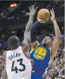  ?? DARRYL DYCK/THE CANADIAN PRESS ?? Golden State Warriors’ David West, right, shoots over Toronto Raptors’ rookie Pascal Siakam during NBA exhibition action Saturday in Vancouver. Raptors were 97-93 winners.