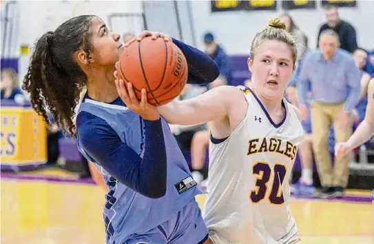  ?? Photos by Jim Franco/Times Union ?? Columbia’s Alivia Landy, left, drives to the basket in front of Duanesburg’s Allison O’Hanlon. Both led their team in scoring.