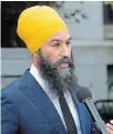  ?? THE CANADIAN PRESS ?? NDP Leader Jagmeet Singh fields questions at city hall in Vancouver on Wednesday.