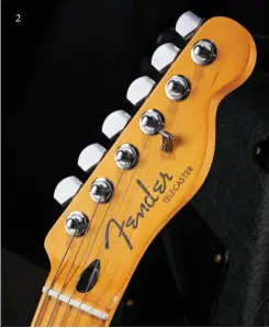  ?? ?? 2 2. Very much the modern Fender, these headstock logos change from bright to dark chrome in different lights