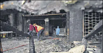  ?? ANI ?? NDRF personnel and other officials inspect the Covid care centre in Vijayawada on Sunday.